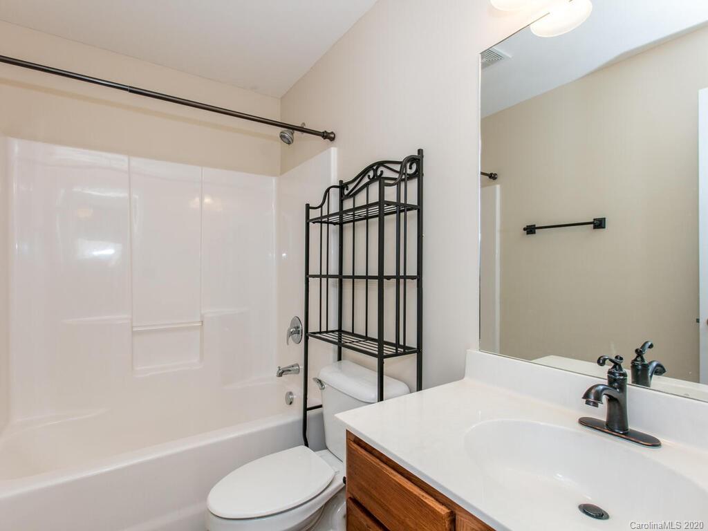 244 Lumber River Road Fletcher, NC 28732 - Photo 29 of 36 a bathroom with a sink toilet and shower