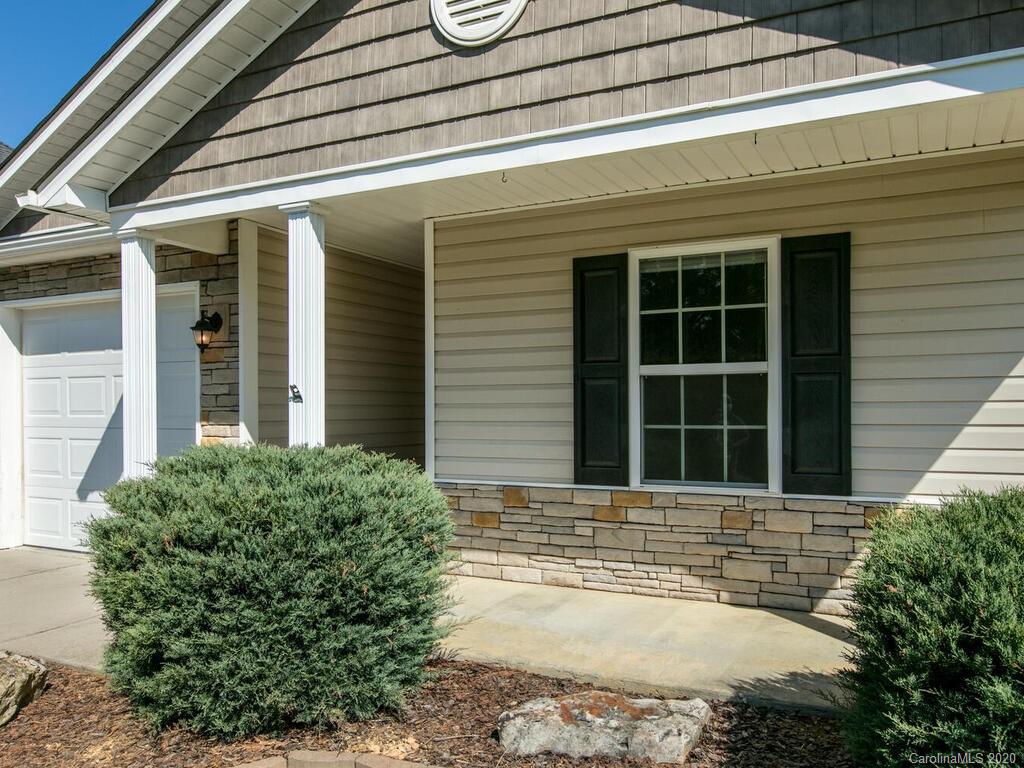 244 Lumber River Road Fletcher, NC 28732 - Photo 4 of 36 a front view of a house with a yard