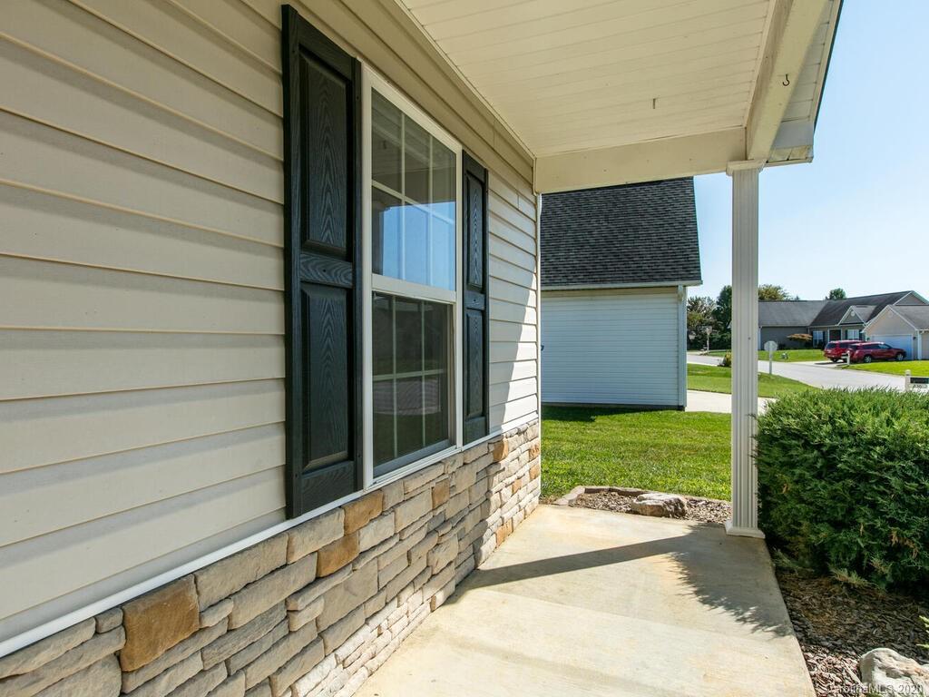244 Lumber River Road Fletcher, NC 28732 - Photo 5 of 36 a house view with a backyard space