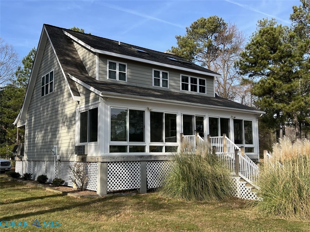 301 Gillim Road Deltaville, VA 23043 - Photo 25 of 31 Back of house with a sunroom and a lawn