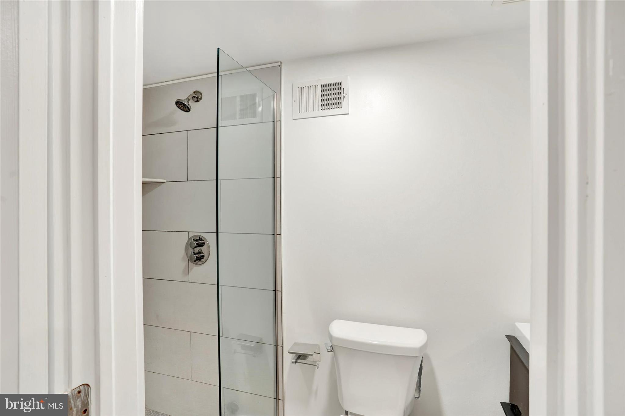 2636 Manton Street Philadelphia, PA 19146 - Photo 13 of 36 a white toilet sitting next to a bathroom sink