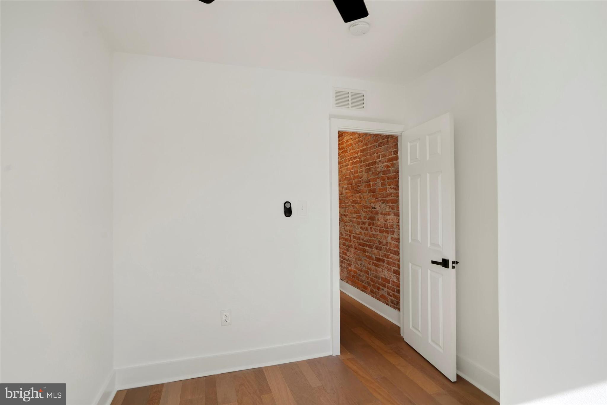 2636 Manton Street Philadelphia, PA 19146 - Photo 17 of 36 a view of a hallway with wooden floor