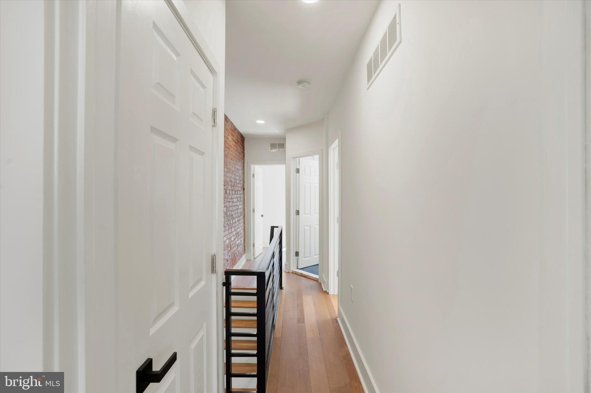 2636 Manton Street Philadelphia, PA 19146 - Photo 26 of 36 a view of a hallway with wooden floor and staircase