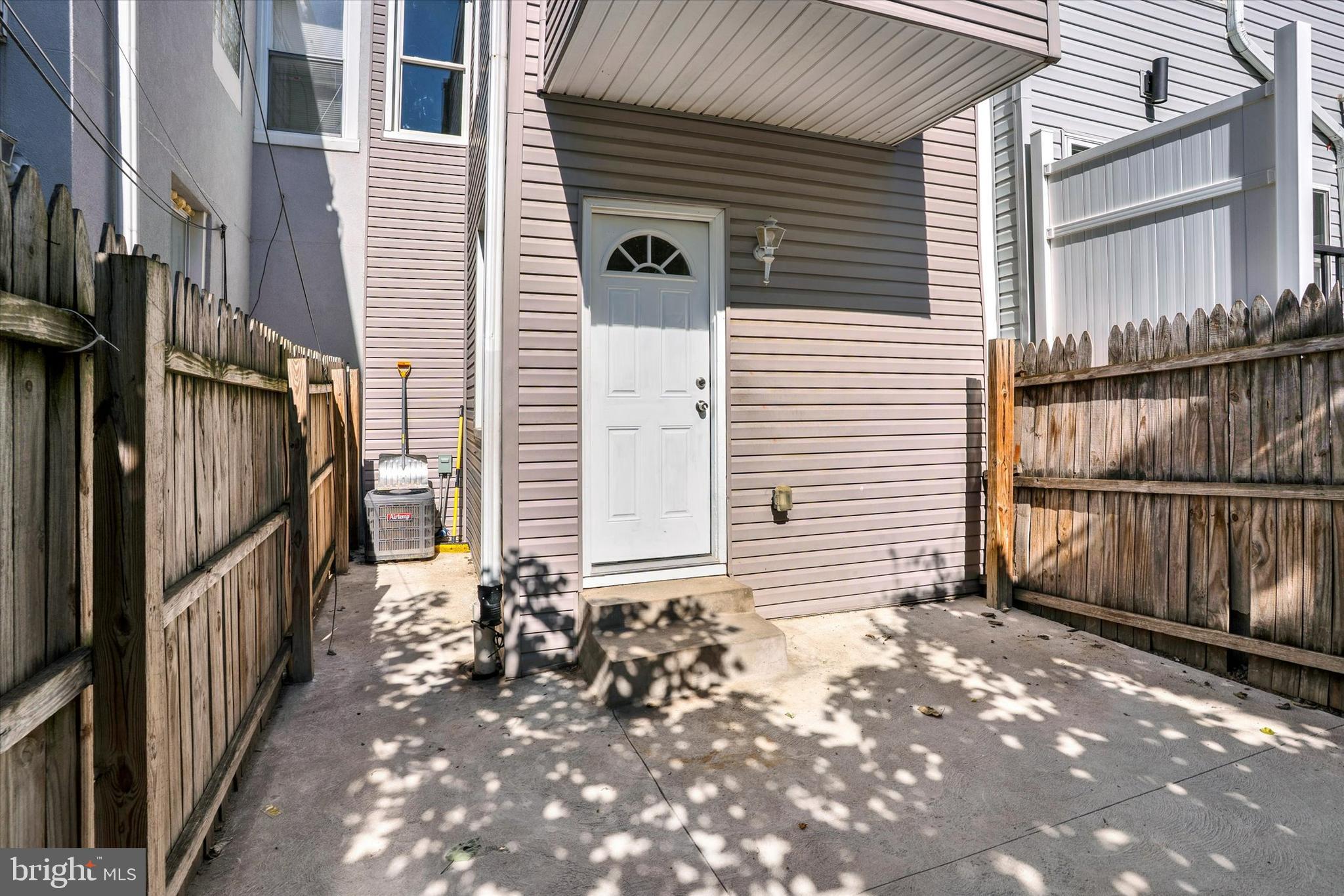 2636 Manton Street Philadelphia, PA 19146 - Photo 29 of 36 a view of a house with a small yard and wooden fence and a stairs