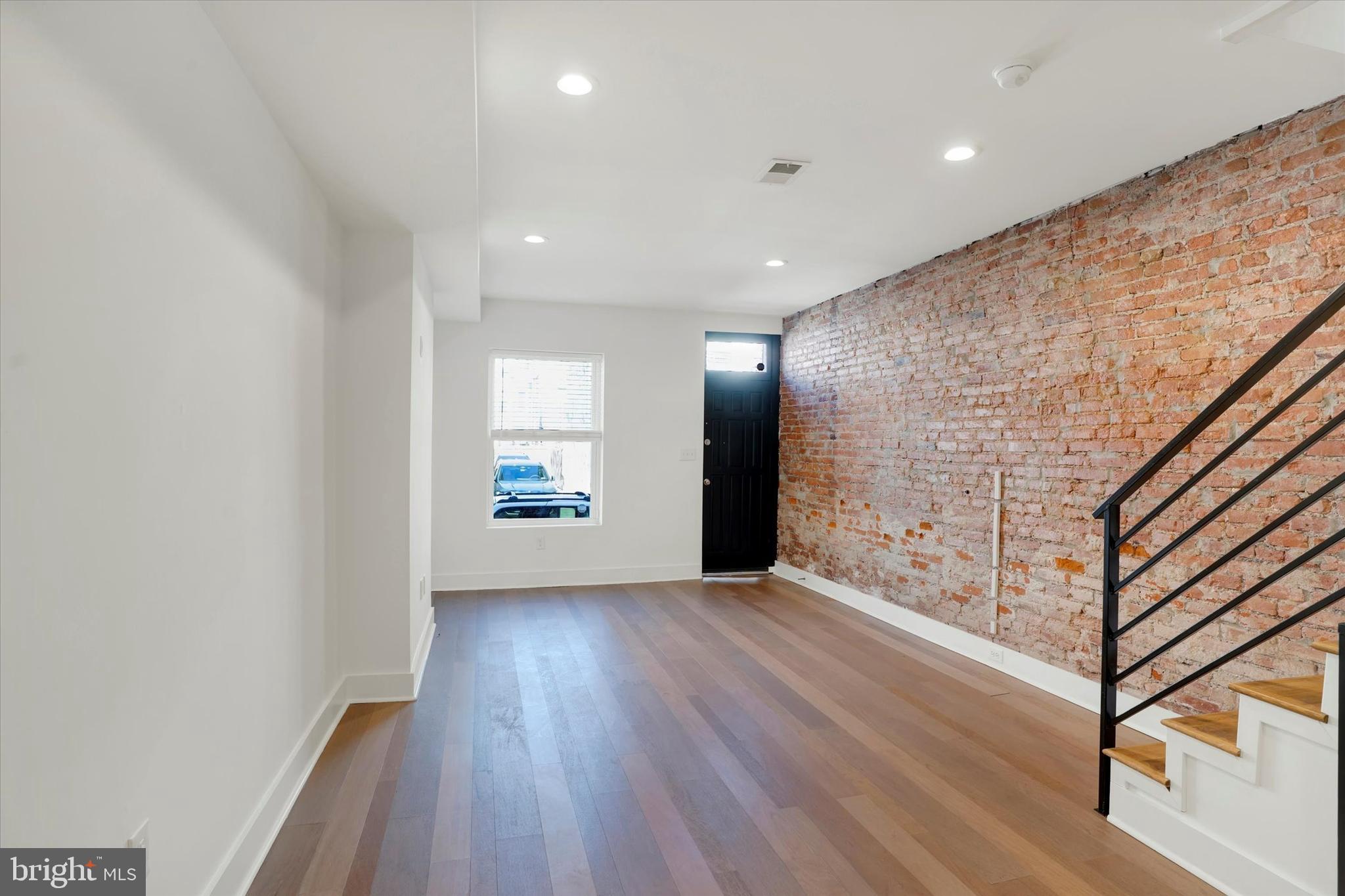 2636 Manton Street Philadelphia, PA 19146 - Photo 8 of 36 a view of an empty room with wooden floor and a window