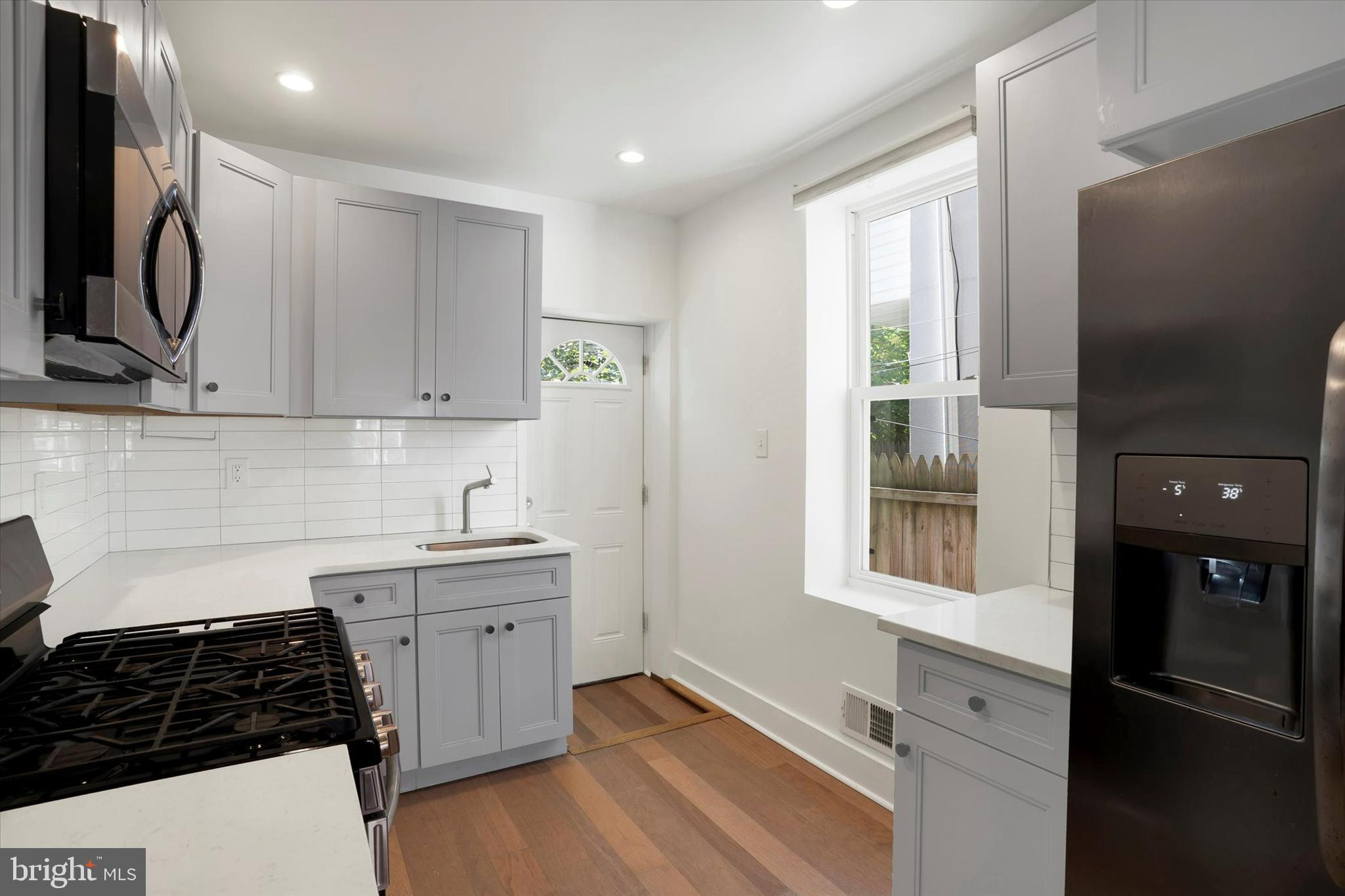 2636 Manton Street Philadelphia, PA 19146 - Photo 10 of 36 a kitchen with stainless steel appliances granite countertop a refrigerator stove and sink