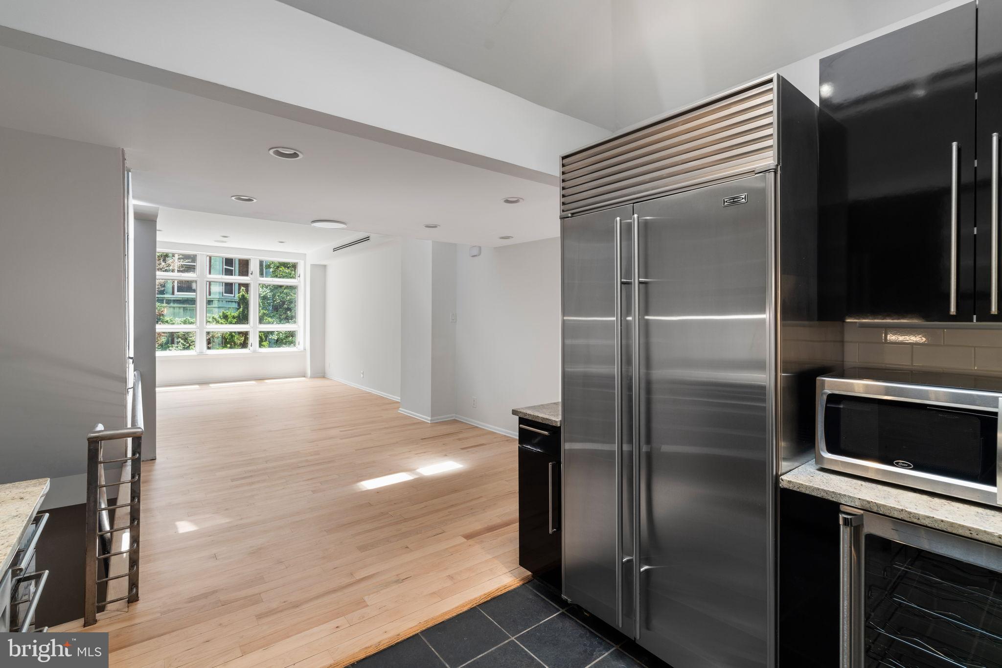 2036 Rittenhouse Square Philadelphia, PA 19103 - Photo 15 of 39 a view of a refrigerator in kitchen and an empty room
