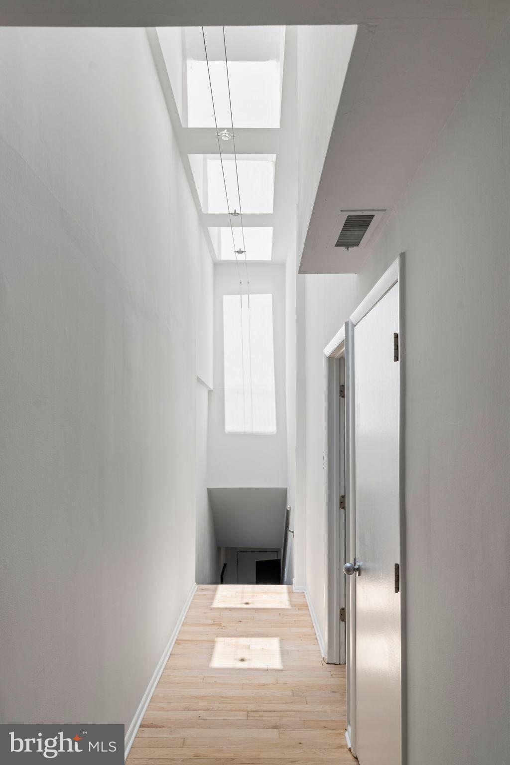 2036 Rittenhouse Square Philadelphia, PA 19103 - Photo 16 of 39 a view of a hallway with wooden floor and staircase