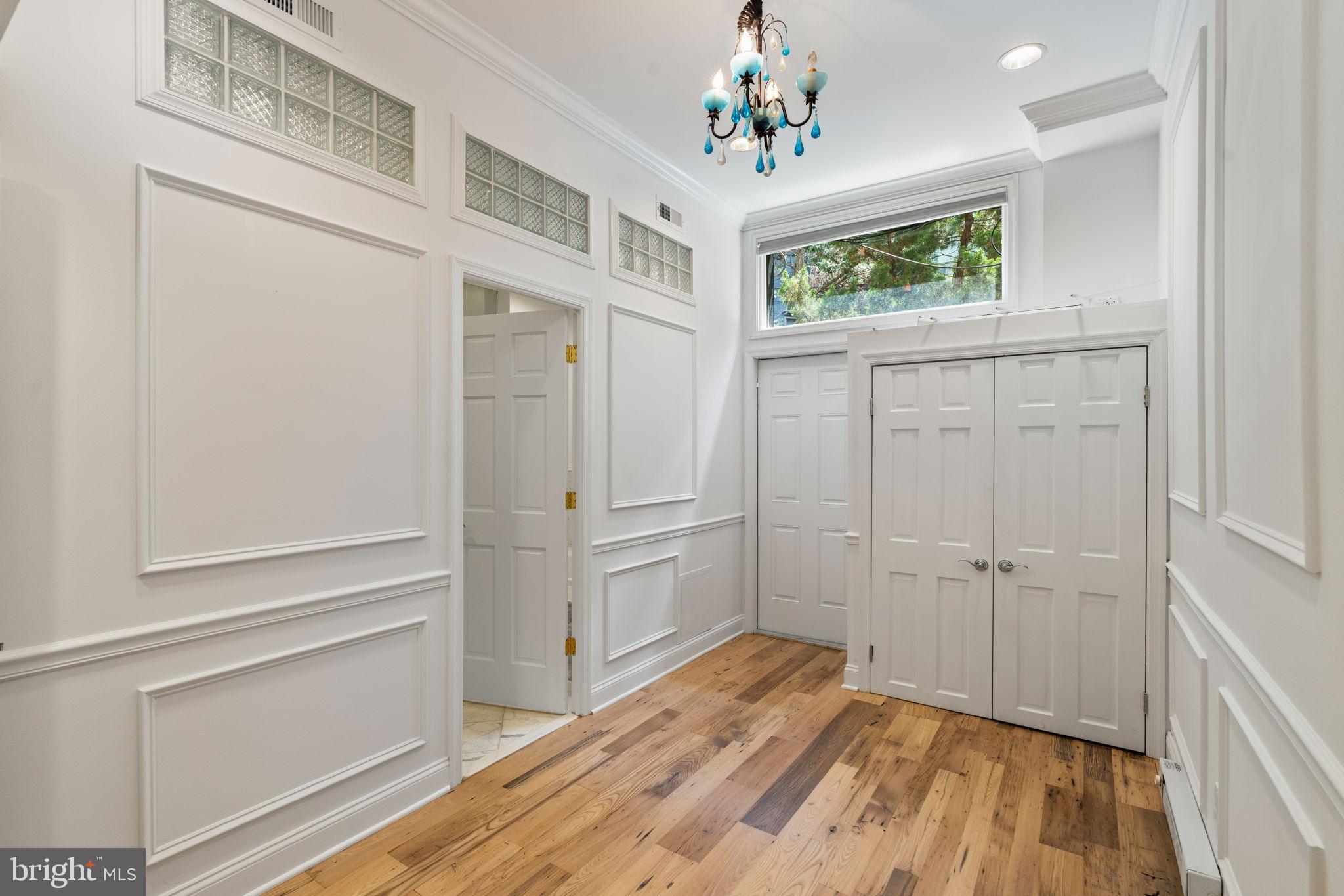 2036 Rittenhouse Square Philadelphia, PA 19103 - Photo 33 of 39 a view of a bedroom with wooden floor and windows
