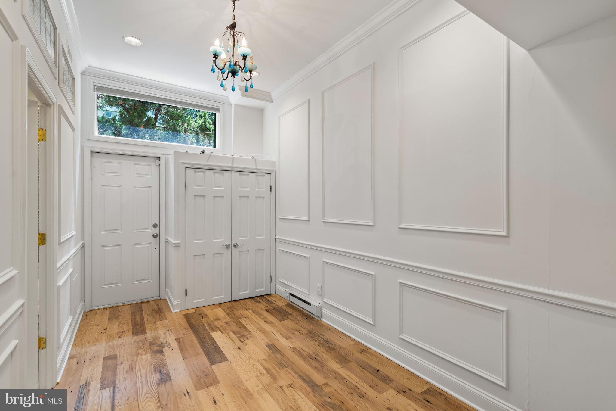 2036 Rittenhouse Square Philadelphia, PA 19103 - Photo 34 of 39 a view of a livingroom with wooden floor and a window