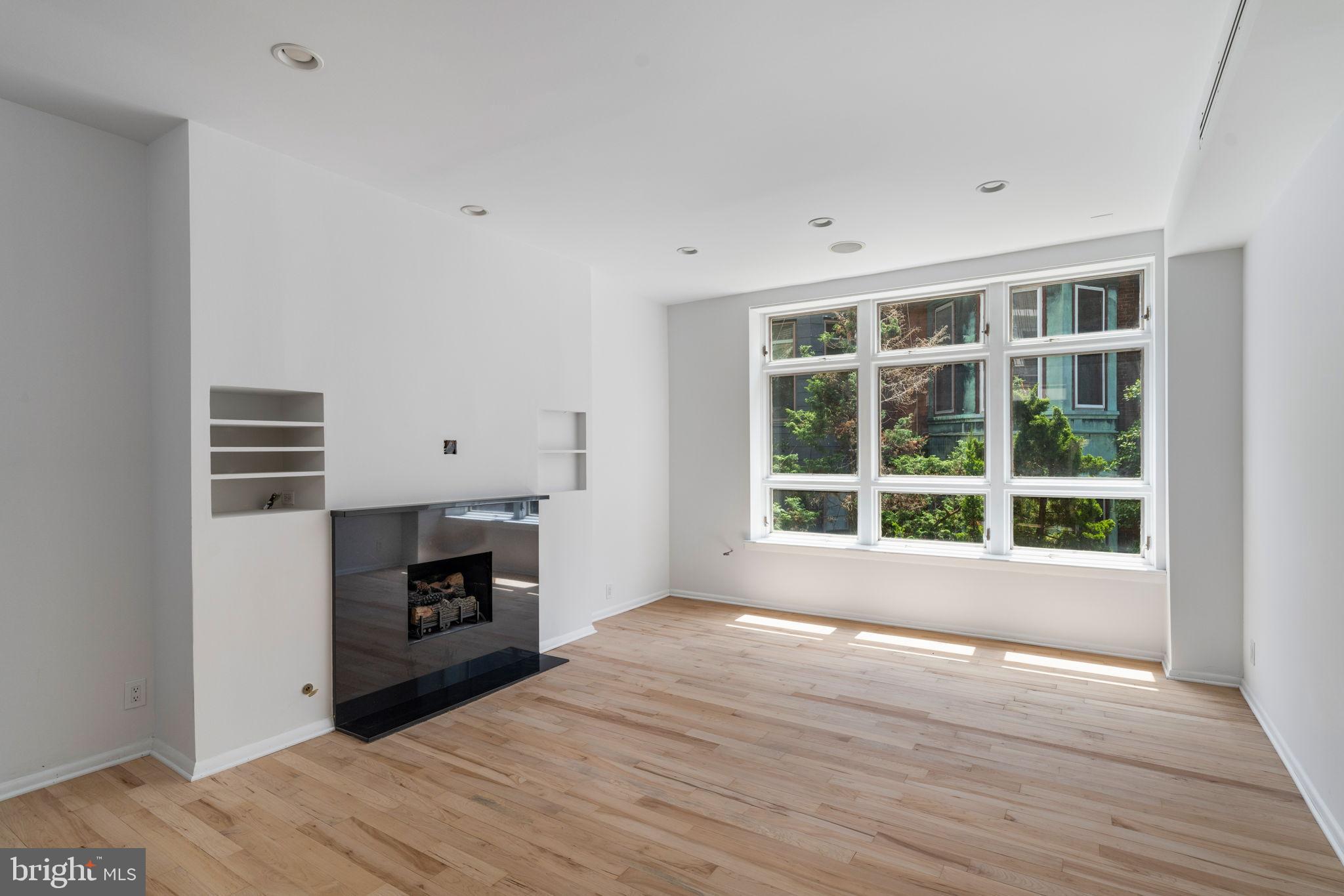 2036 Rittenhouse Square Philadelphia, PA 19103 - Photo 7 of 39 a view of empty room with wooden floor and fan