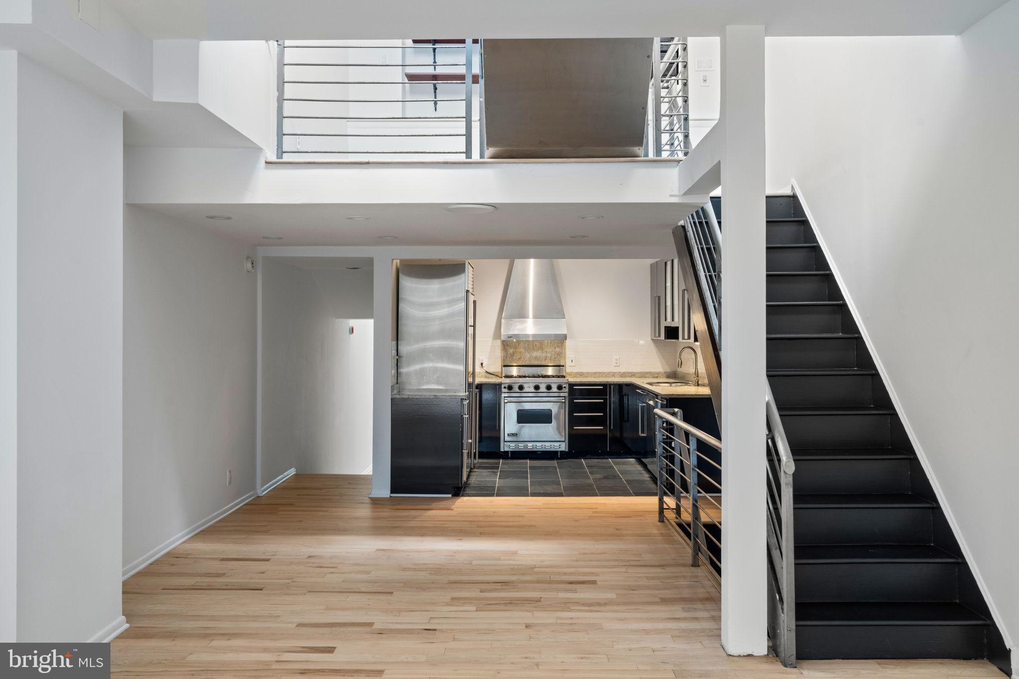 2036 Rittenhouse Square Philadelphia, PA 19103 - Photo 10 of 39 a view of a hallway with wooden floor and staircase