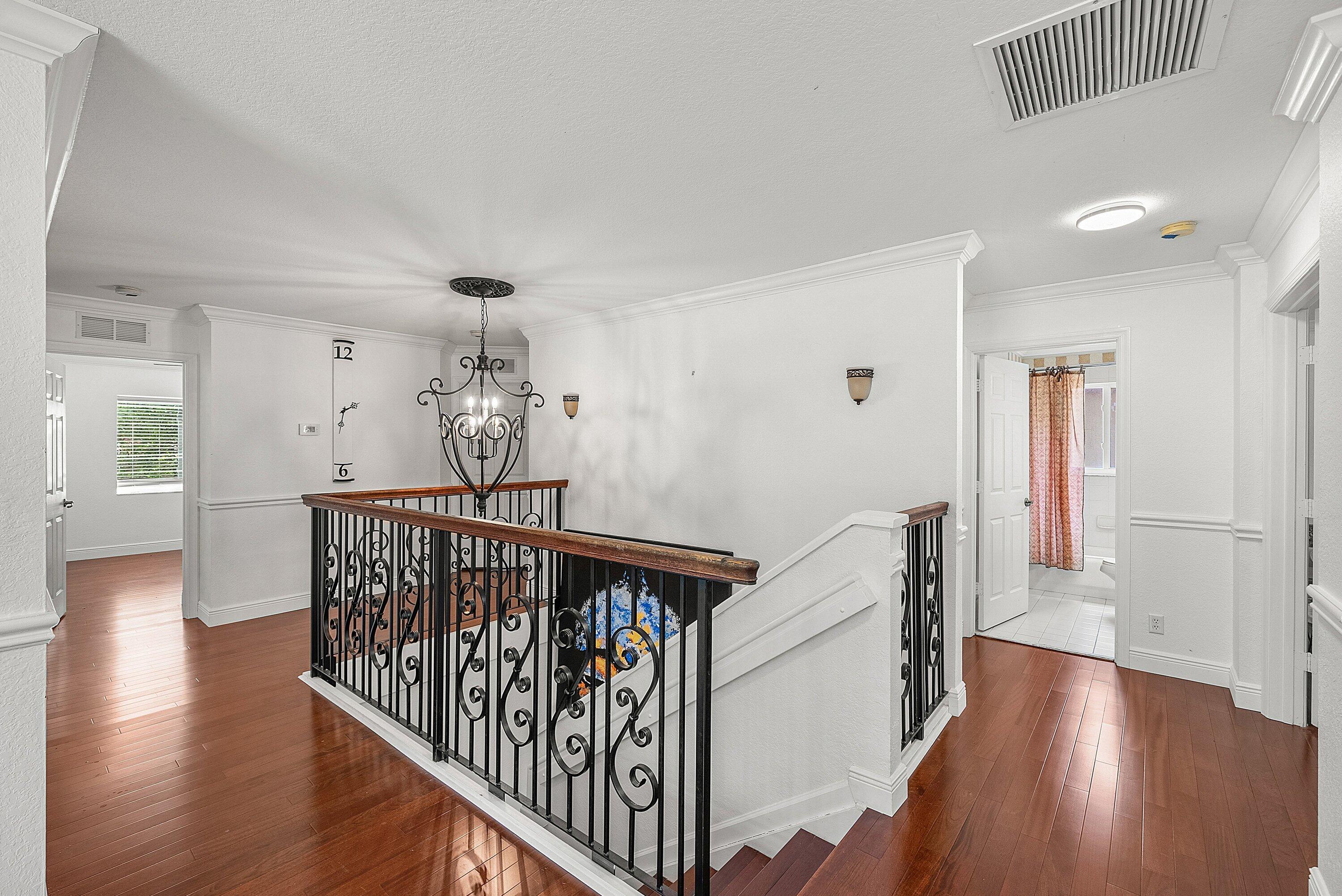 1509 Sage Wood Court Riviera Beach, FL 33404 - Photo 24 of 59 a view of entryway with wooden floor