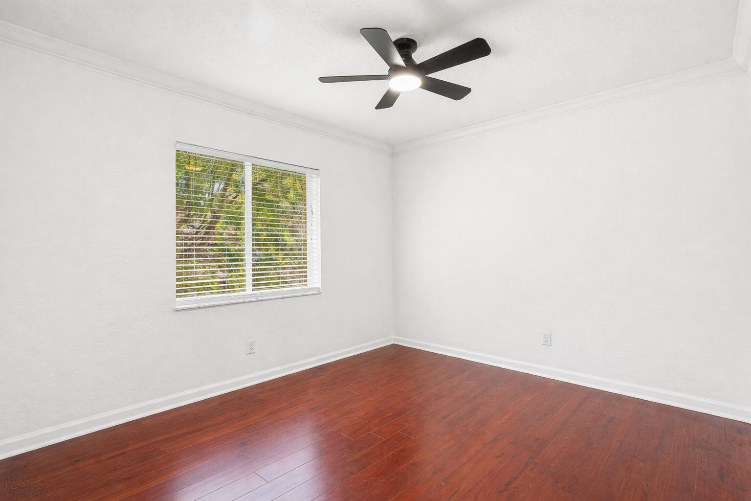 1509 Sage Wood Court Riviera Beach, FL 33404 - Photo 28 of 59 an empty room with wooden floor and windows
