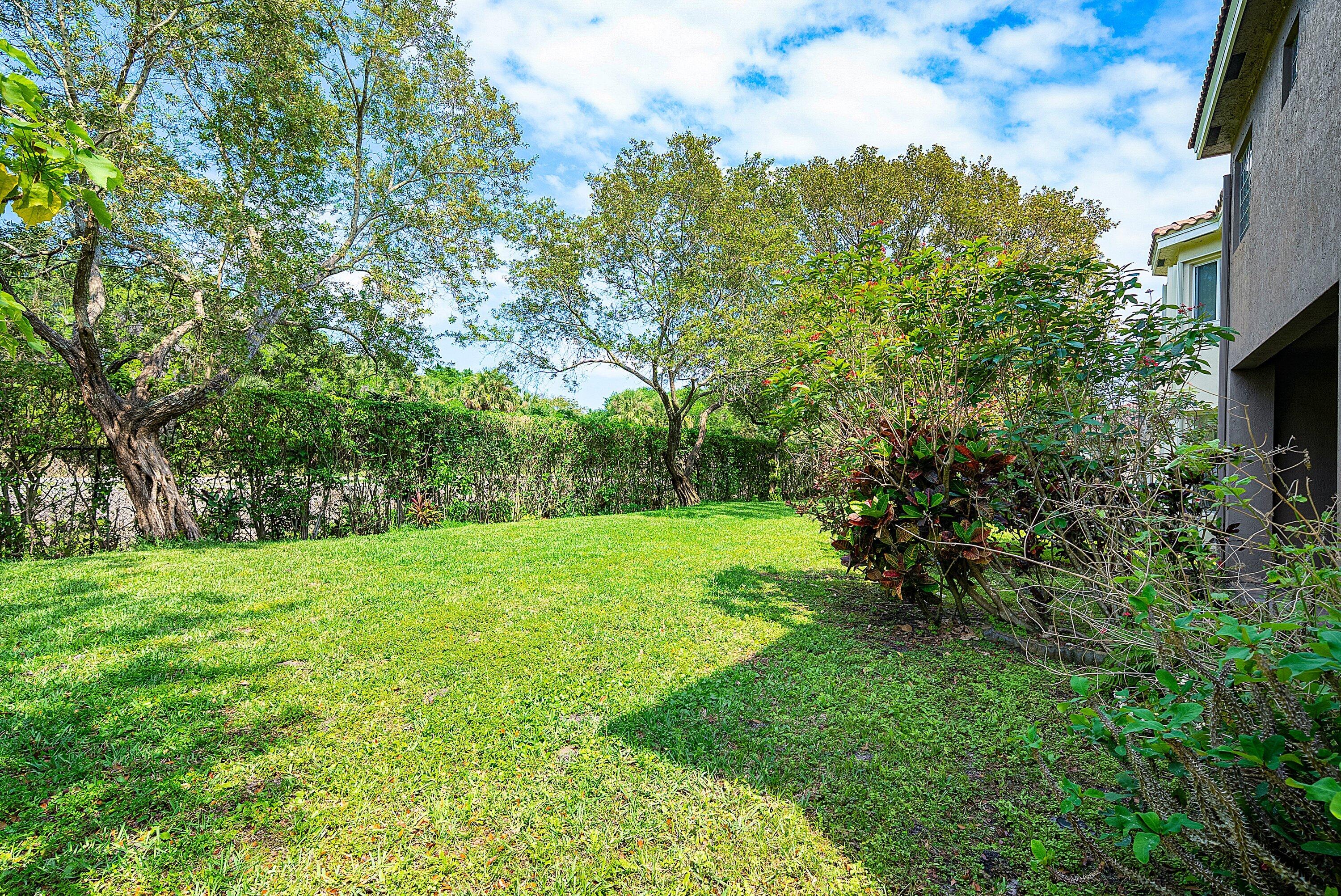 1509 Sage Wood Court Riviera Beach, FL 33404 - Photo 44 of 59 a view of an outdoor space and a yard