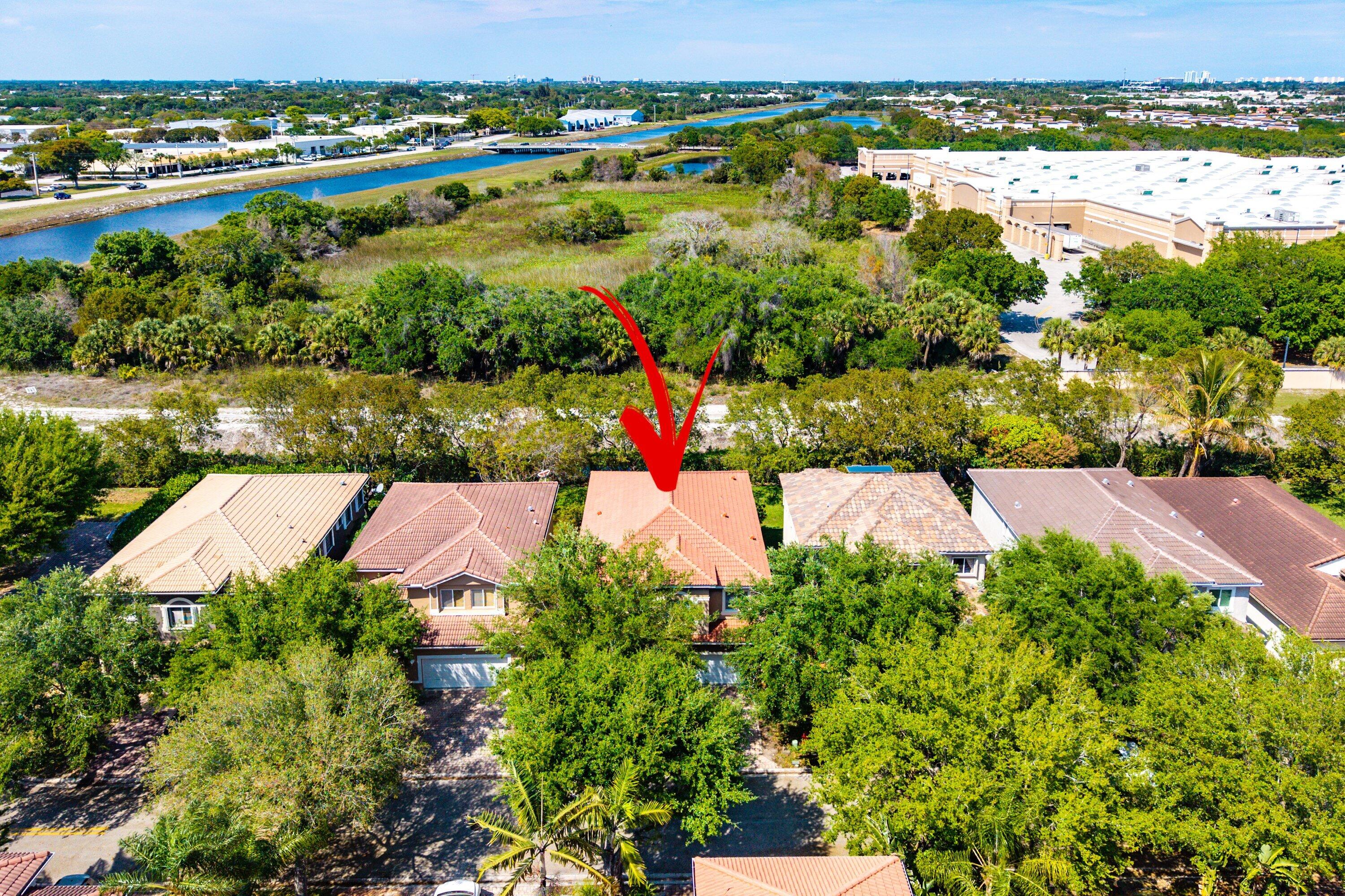 1509 Sage Wood Court Riviera Beach, FL 33404 - Photo 48 of 59 an aerial view of a houses with outdoor space and swimming pool