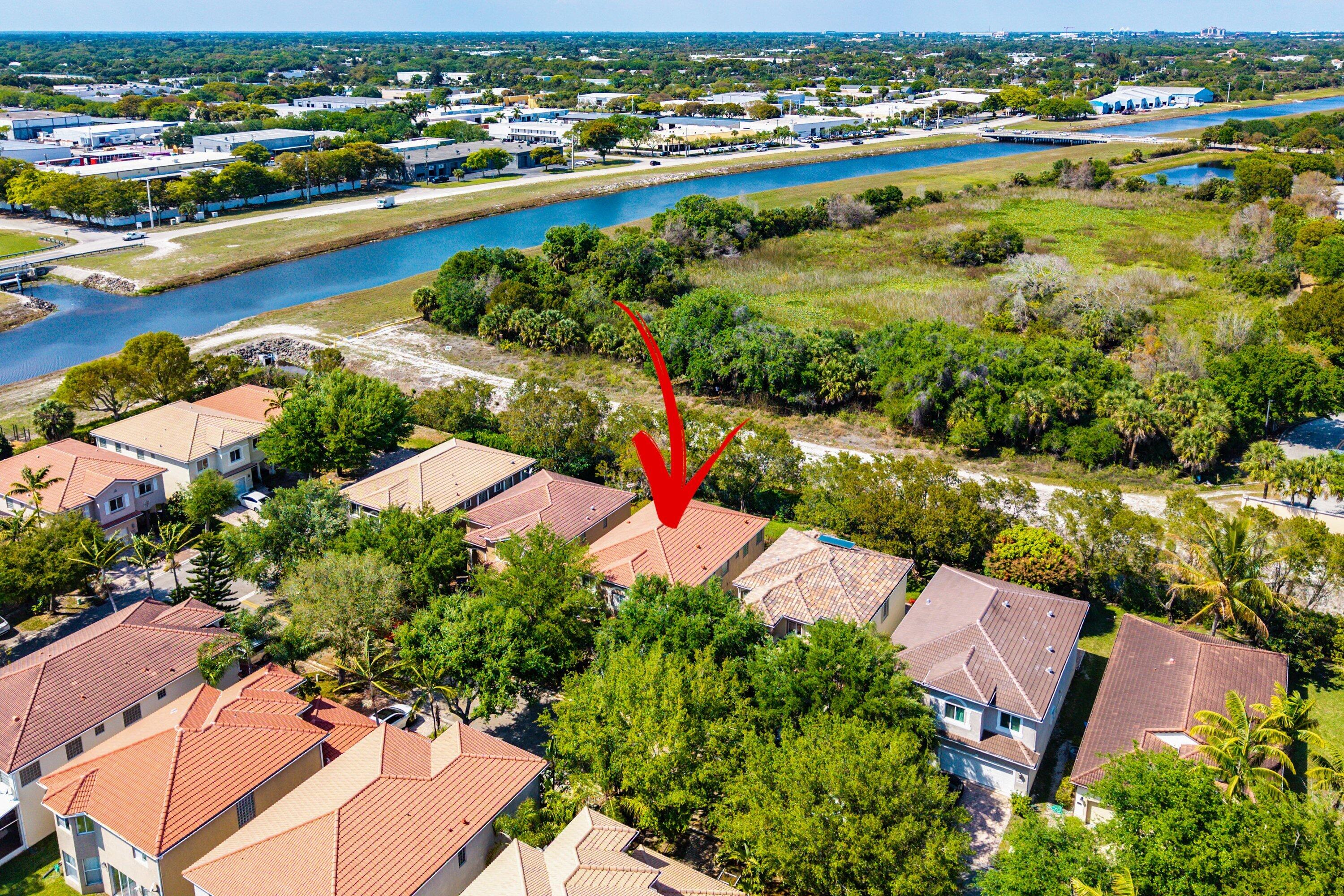 1509 Sage Wood Court Riviera Beach, FL 33404 - Photo 49 of 59 an aerial view of residential houses with outdoor space and river