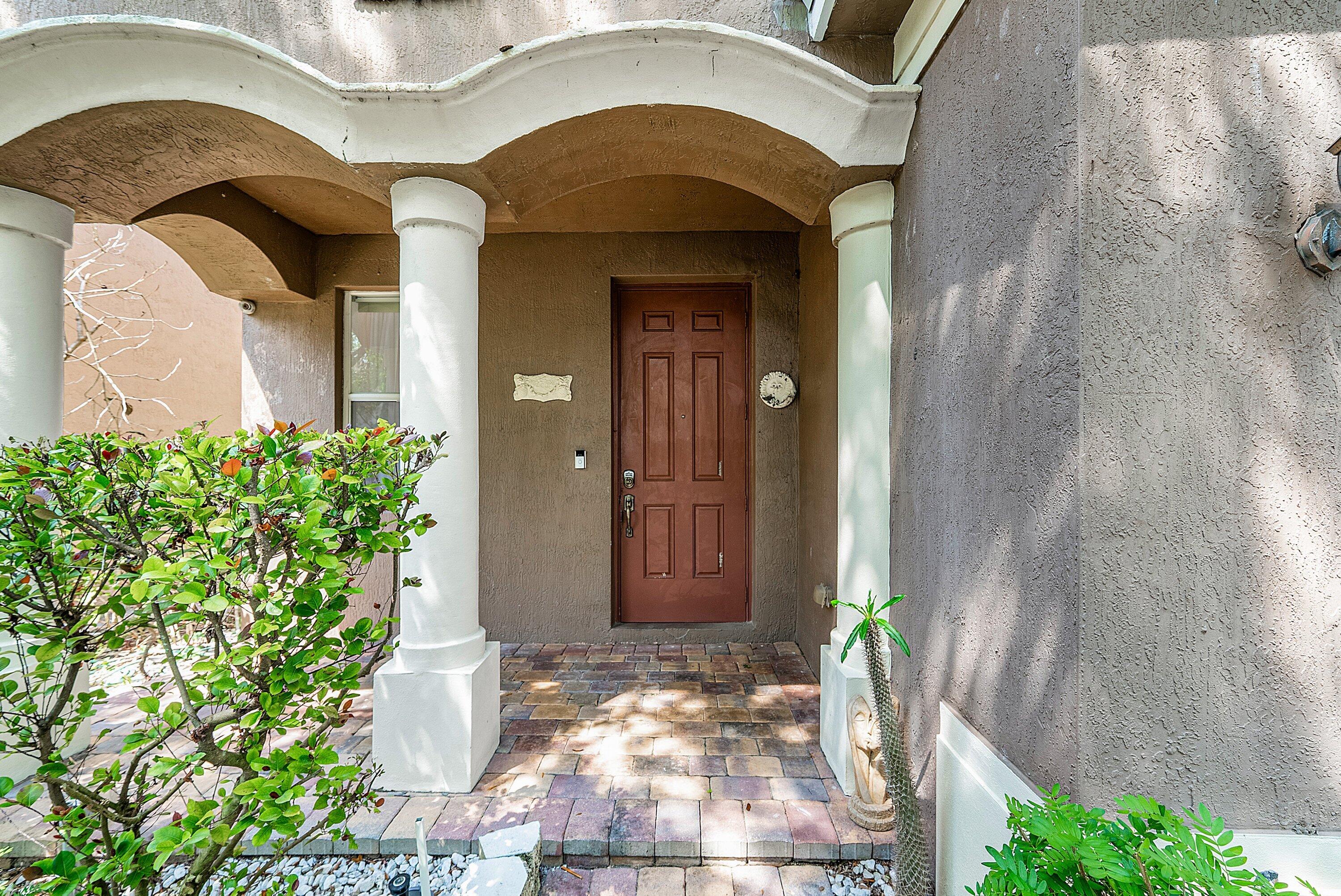 1509 Sage Wood Court Riviera Beach, FL 33404 - Photo 5 of 59 a view of entrance gate of house