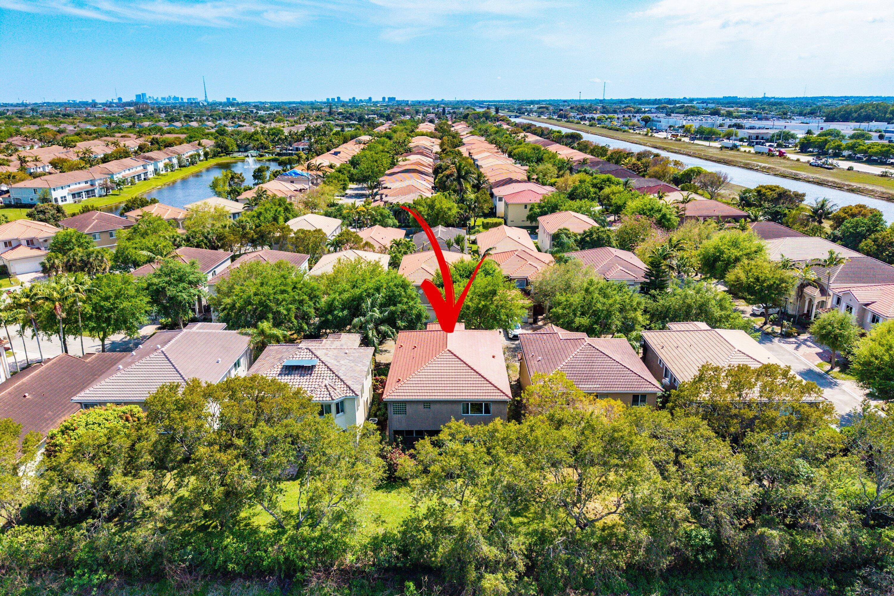 1509 Sage Wood Court Riviera Beach, FL 33404 - Photo 52 of 59 an aerial view of house with yard swimming pool and outdoor seating