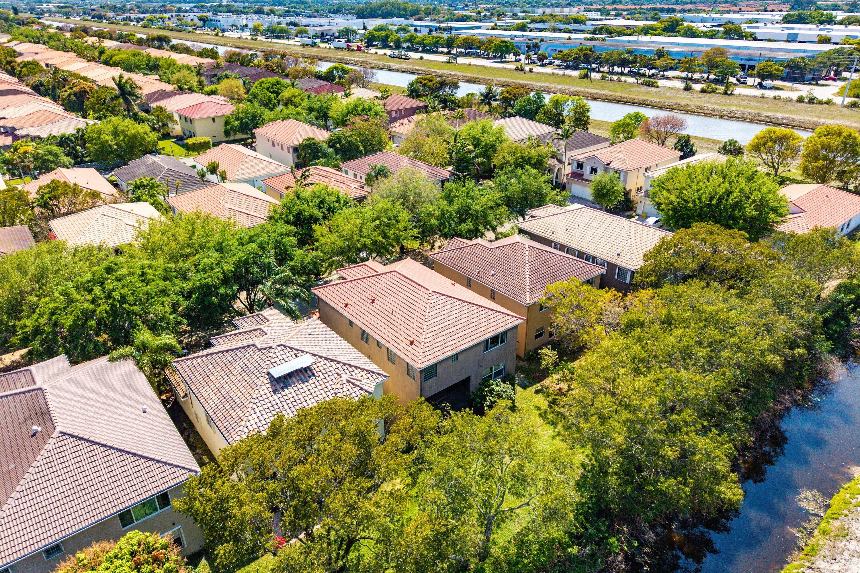 1509 Sage Wood Court Riviera Beach, FL 33404 - Photo 55 of 59 an aerial view of a house with a lake view