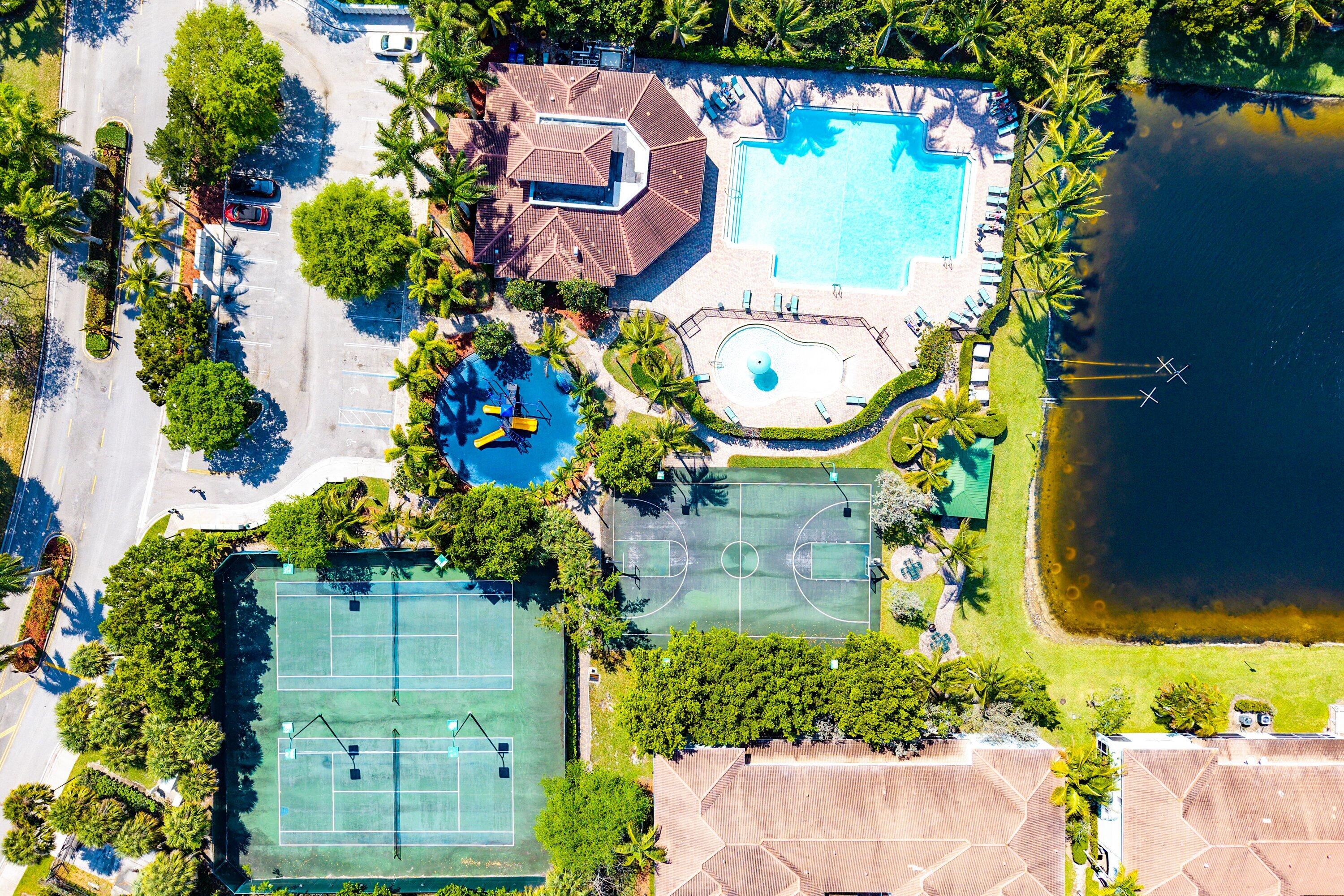 1509 Sage Wood Court Riviera Beach, FL 33404 - Photo 56 of 59 an aerial view of a house with a garden