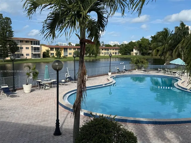 a view of swimming pool with chairs
