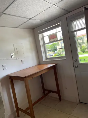 a room with window and a sink
