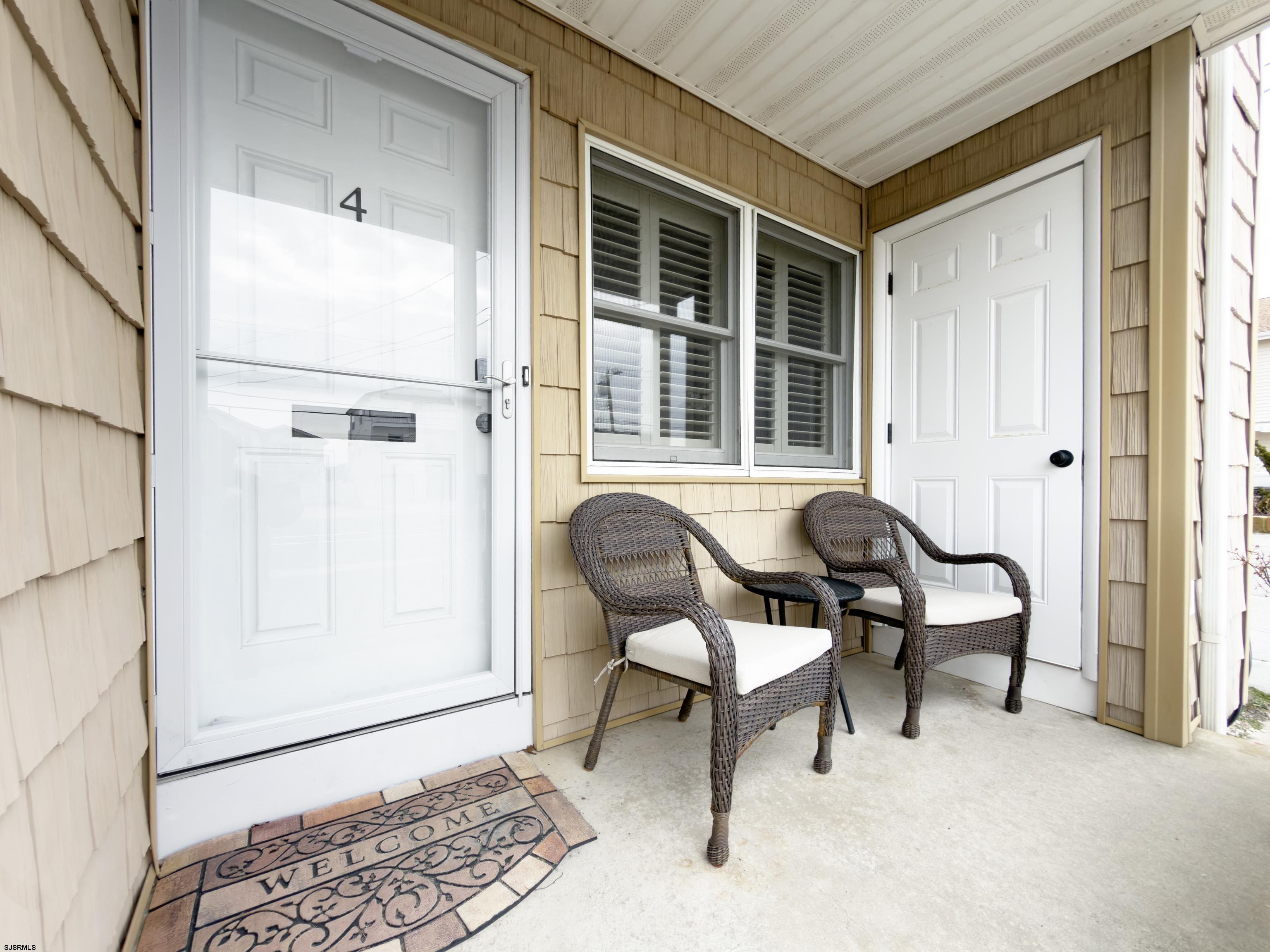 313 West Brigantine Avenue, Unit 4 Brigantine, NJ 08203 - Photo 18 of 38 a balcony with table and chairs