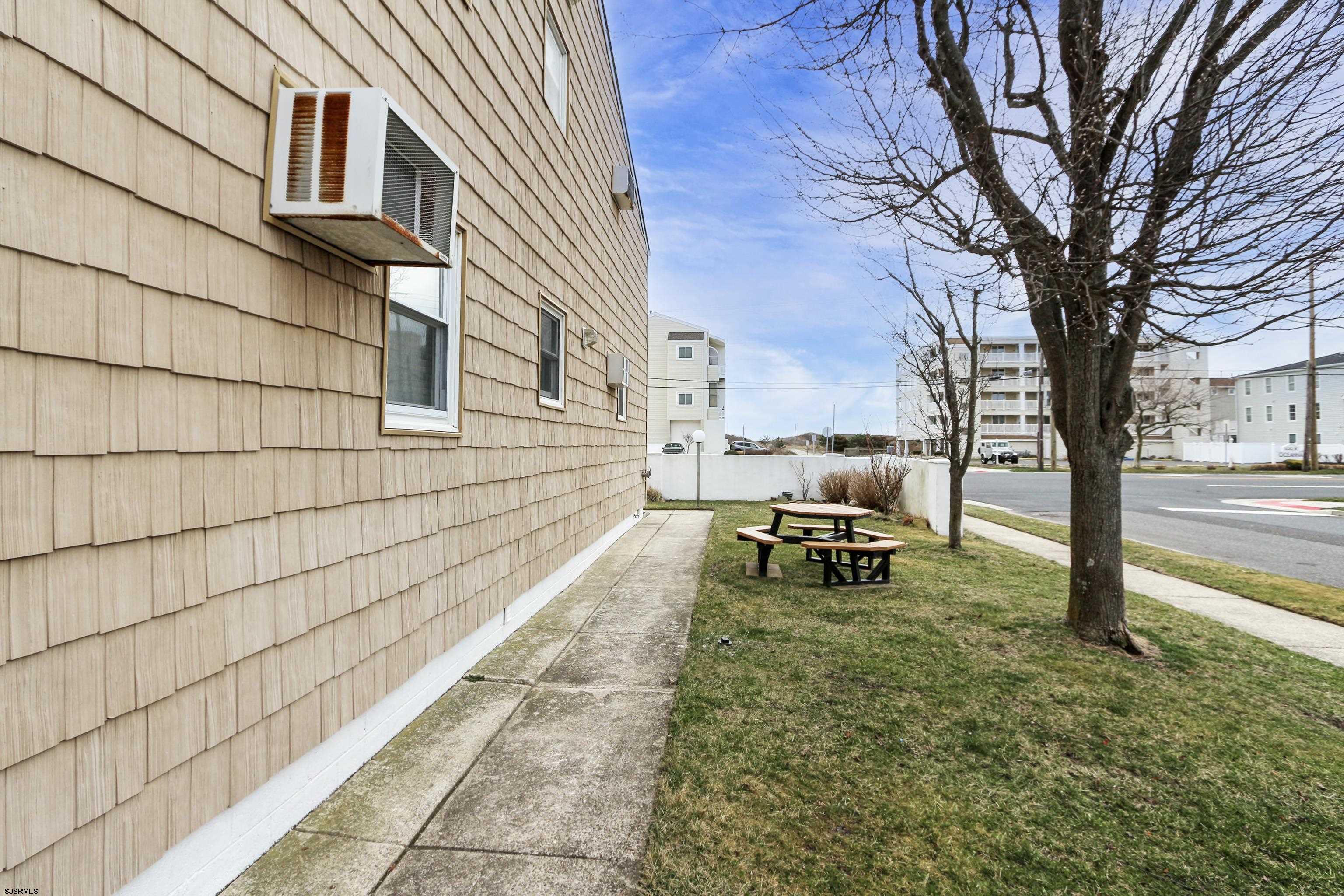 313 West Brigantine Avenue, Unit 4 Brigantine, NJ 08203 - Photo 21 of 38 a bench is sitting in middle of a building