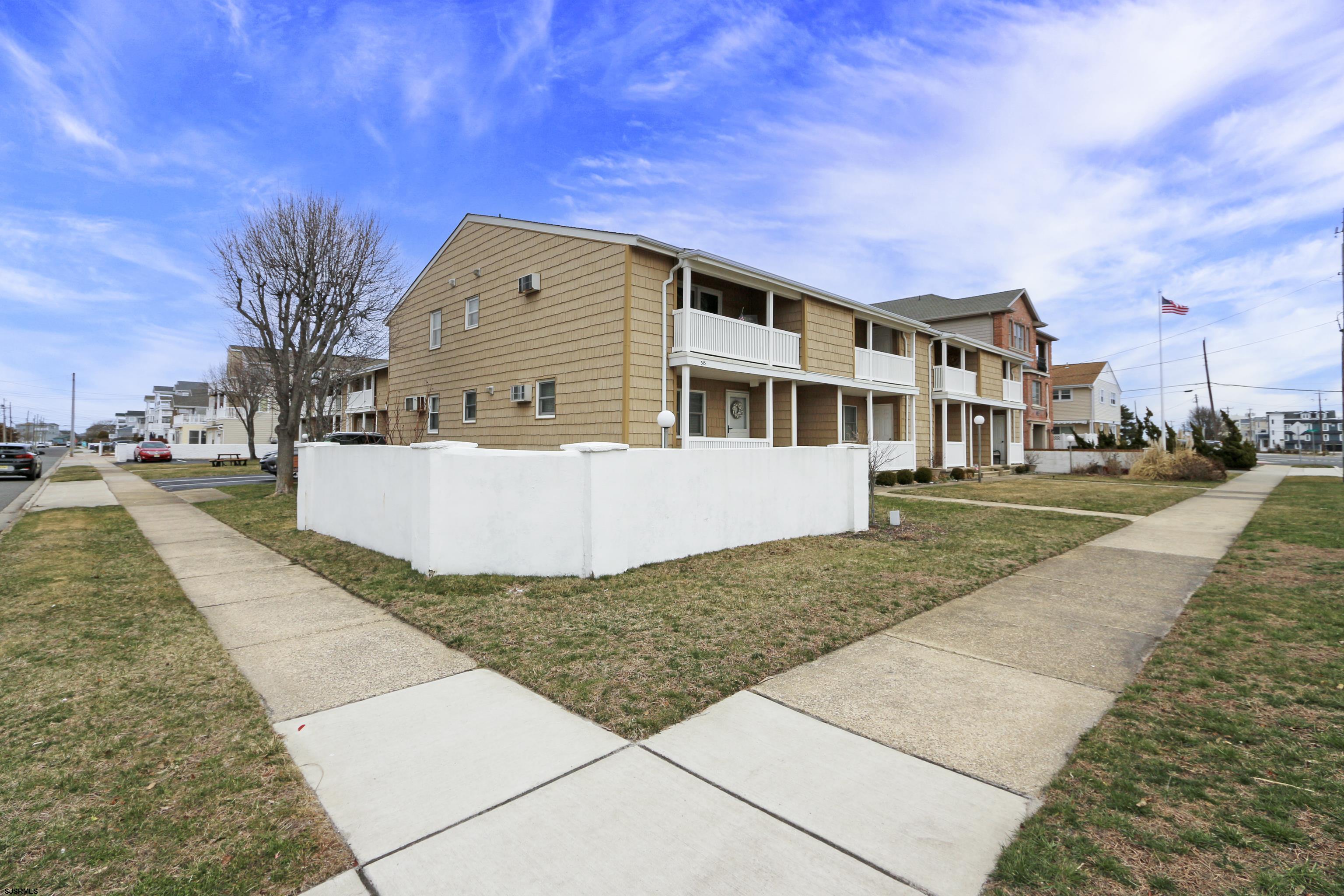 313 West Brigantine Avenue, Unit 4 Brigantine, NJ 08203 - Photo 22 of 38 a front view of a house with a yard