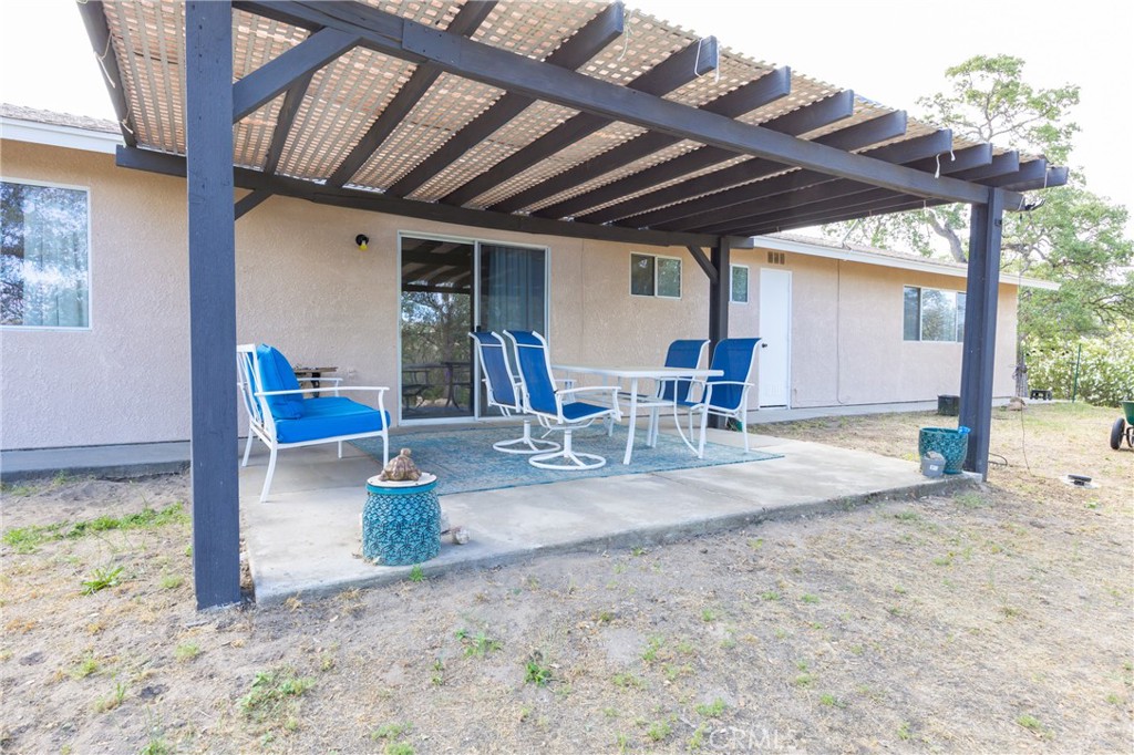 30142 Revis Road Coarsegold, CA 93614 - Photo 28 of 43 a view of a porch with furniture and a yard
