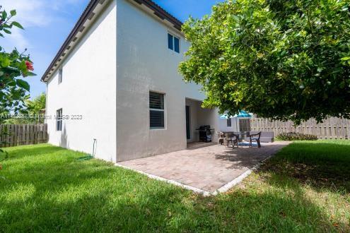 11850 Southwest 250th Terrace Homestead, FL 33032 - Photo 16 of 47 a view of backyard of house with green space and seating area