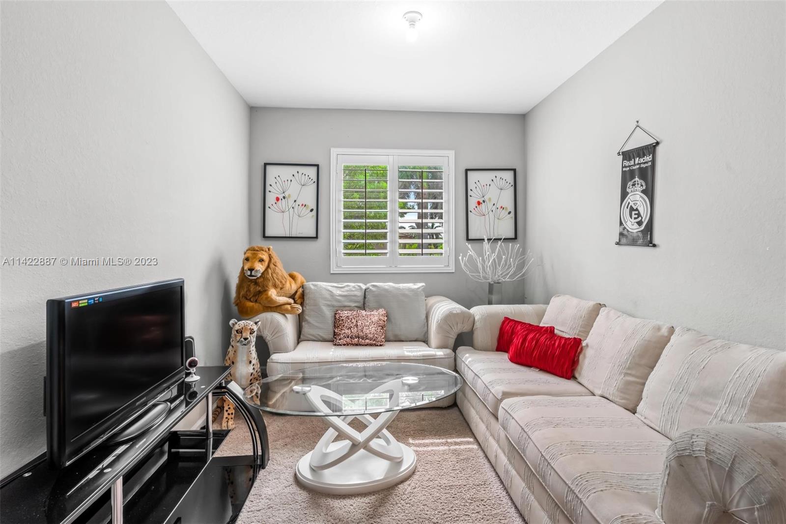 11850 Southwest 250th Terrace Homestead, FL 33032 - Photo 30 of 47 a living room with furniture and a flat screen tv