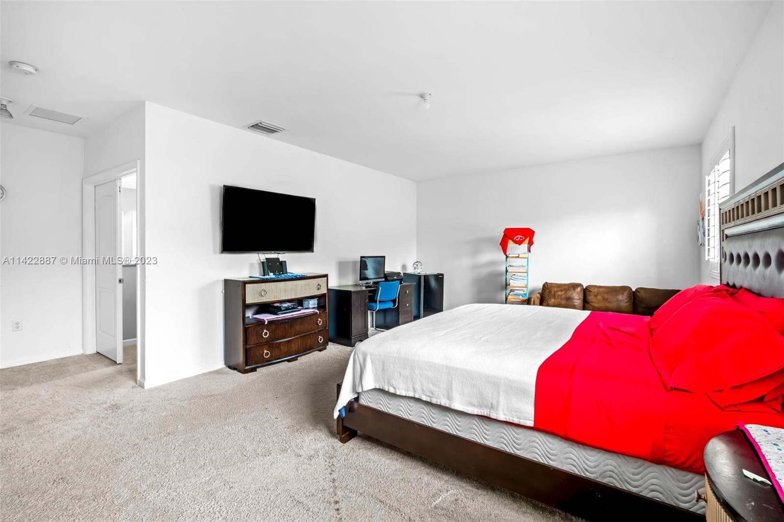 11850 Southwest 250th Terrace Homestead, FL 33032 - Photo 31 of 47 a bedroom with a bed and a flat screen tv