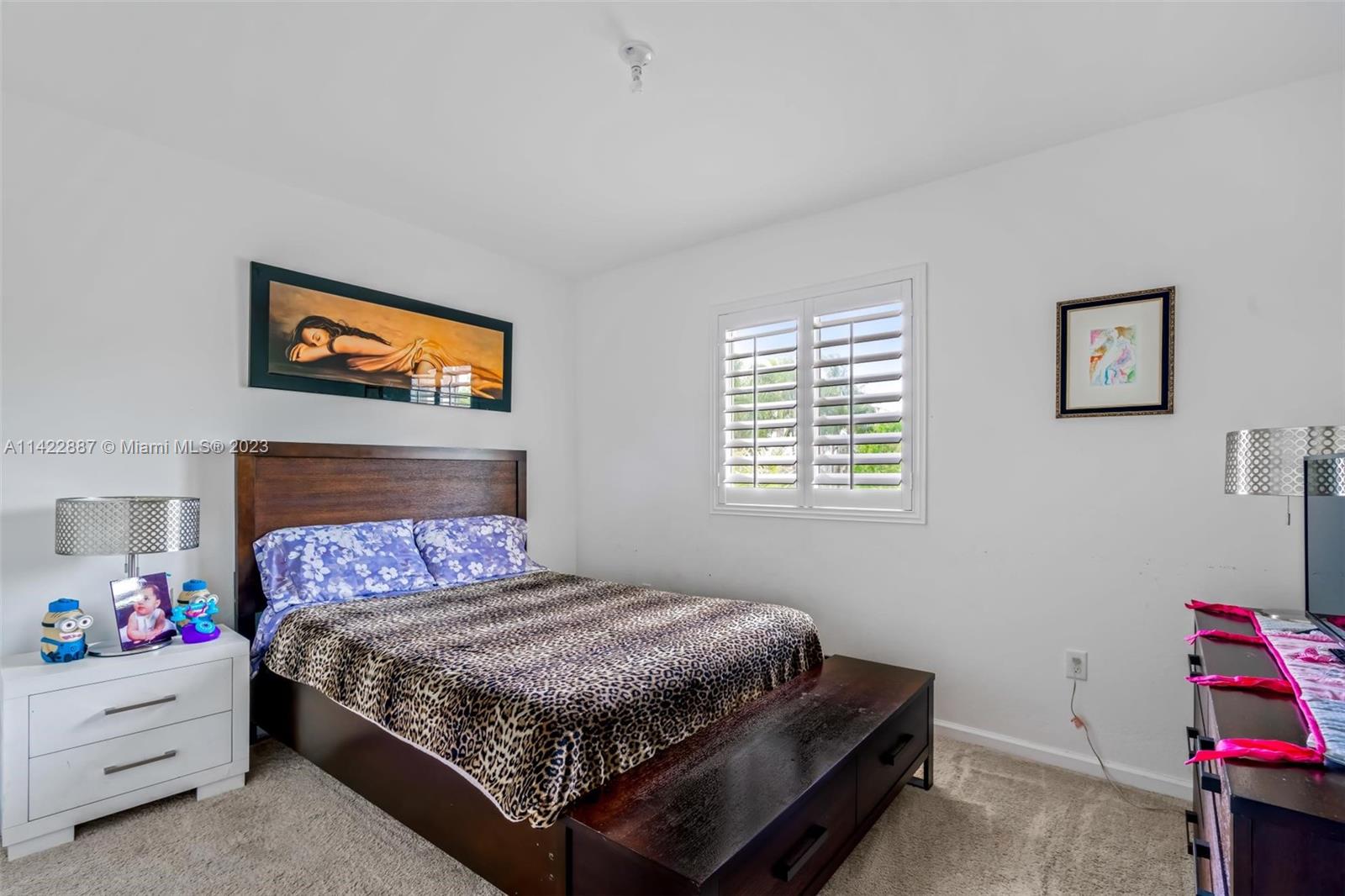 11850 Southwest 250th Terrace Homestead, FL 33032 - Photo 37 of 47 a bedroom with a bed and a window