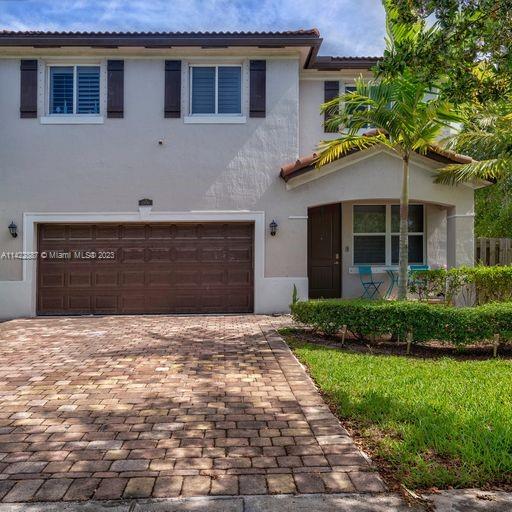11850 Southwest 250th Terrace Homestead, FL 33032 - Photo 8 of 47 a front view of a house with a yard