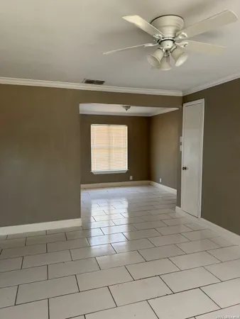 a view of an empty room and window