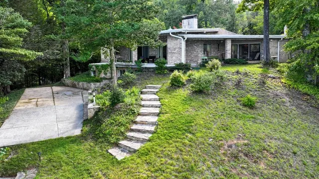a view of kitchen with granite countertop lots of counter top space