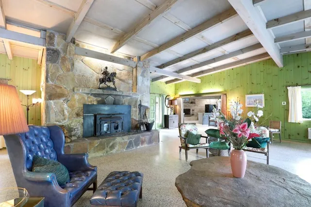 a view of a glass door with a yard from a window