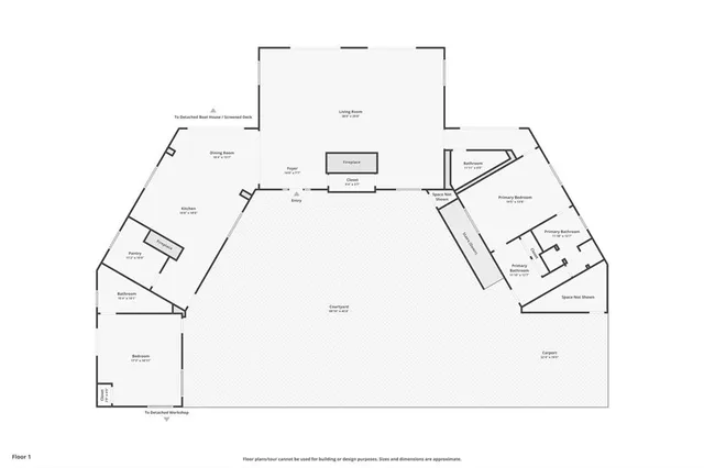 a living room with furniture and flowers