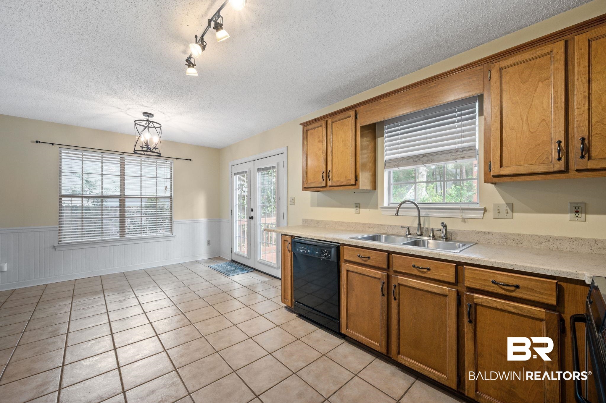100 Montclair Loop Daphne, AL 36526 - Photo 16 of 39 Kitchen featuring sink, french doors, dishwasher, and plenty of natural light