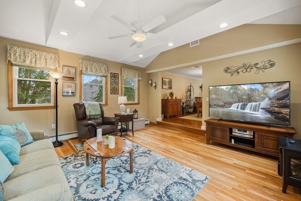 27 Phyllis Road Raynham, MA 02767 - Photo 16 of 42 a living room with furniture and a flat screen tv