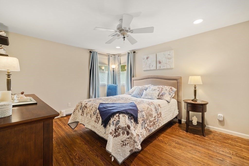 27 Phyllis Road Raynham, MA 02767 - Photo 20 of 42 a bedroom with a bed and wooden floor