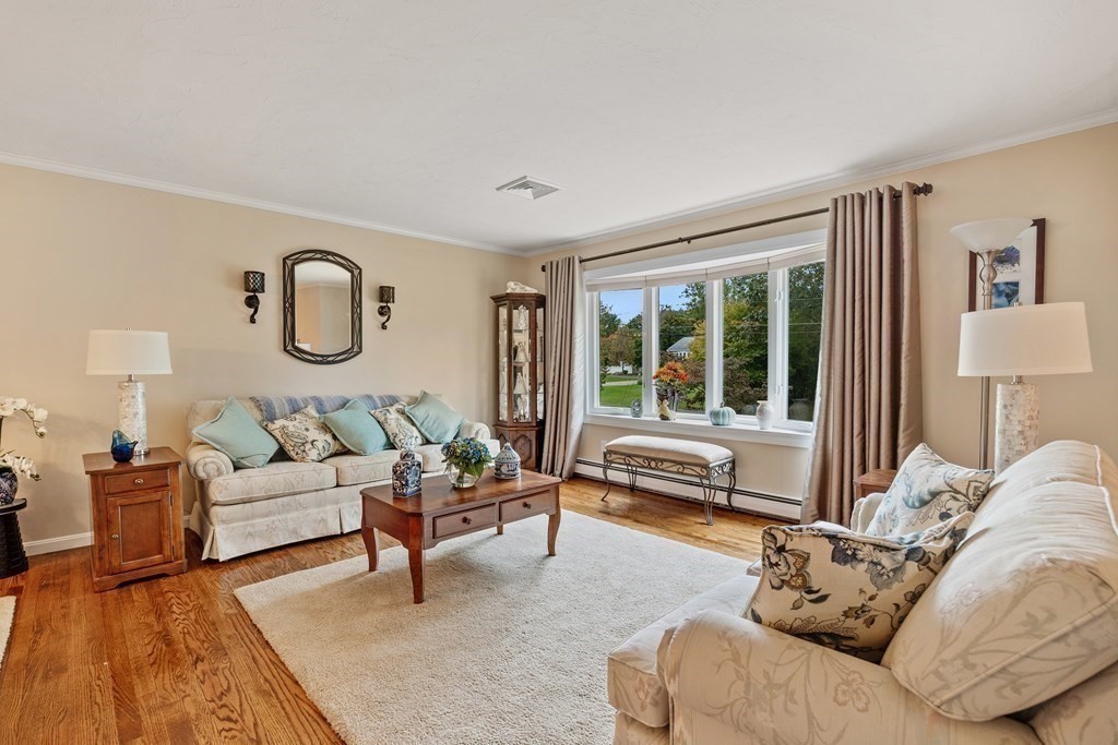 27 Phyllis Road Raynham, MA 02767 - Photo 2 of 42 a living room with furniture and a large window