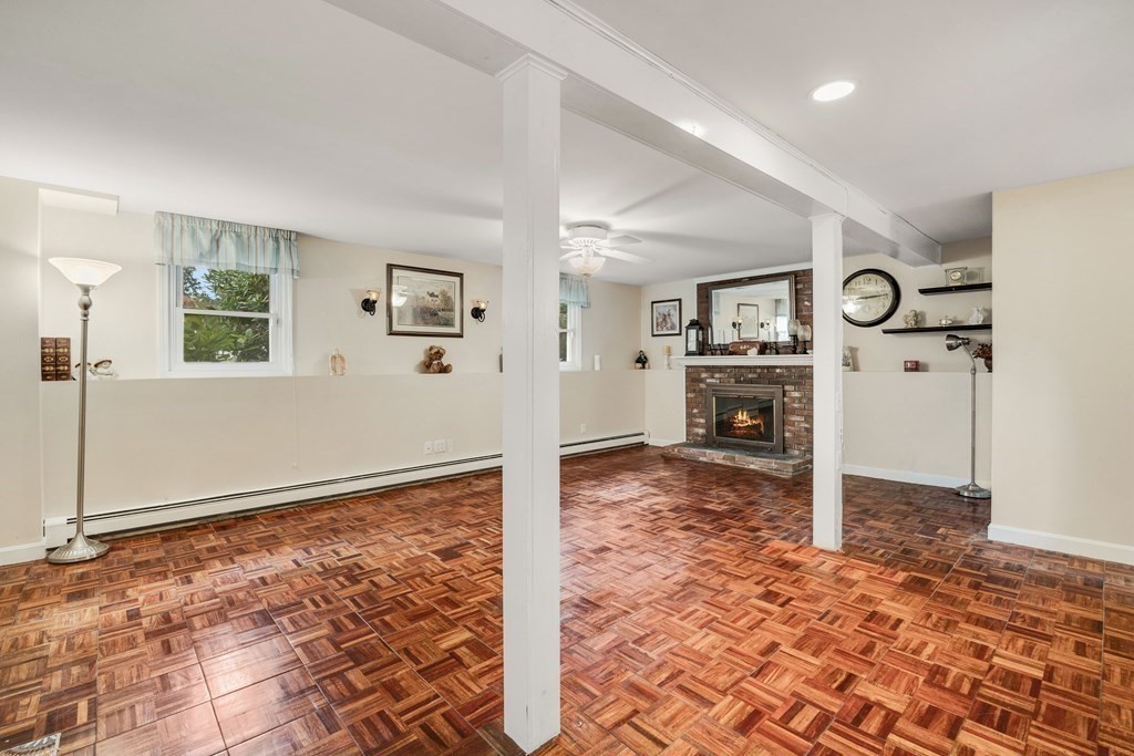 27 Phyllis Road Raynham, MA 02767 - Photo 29 of 42 a view of a livingroom with wooden floor and a refrigerator