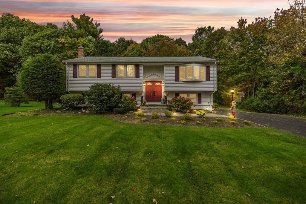 27 Phyllis Road Raynham, MA 02767 - Photo 42 of 42 a front view of a house with garden and trees