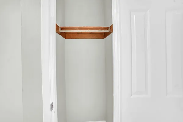 a kitchen with granite countertop cabinets and white appliances