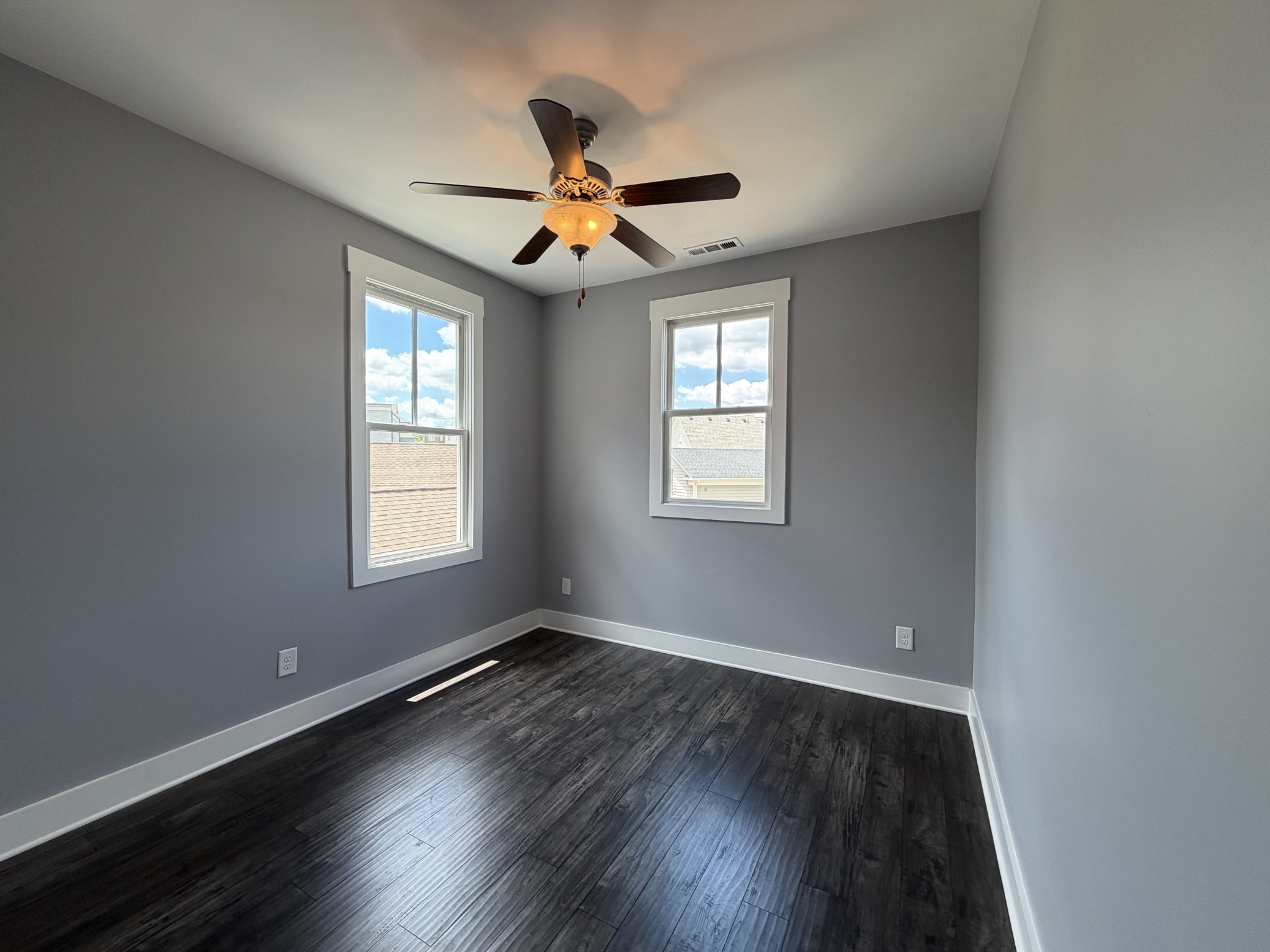 3097 Rural Plains Circle Franklin, TN 37064 - Photo 11 of 28 a view of empty room with wooden floor and fan