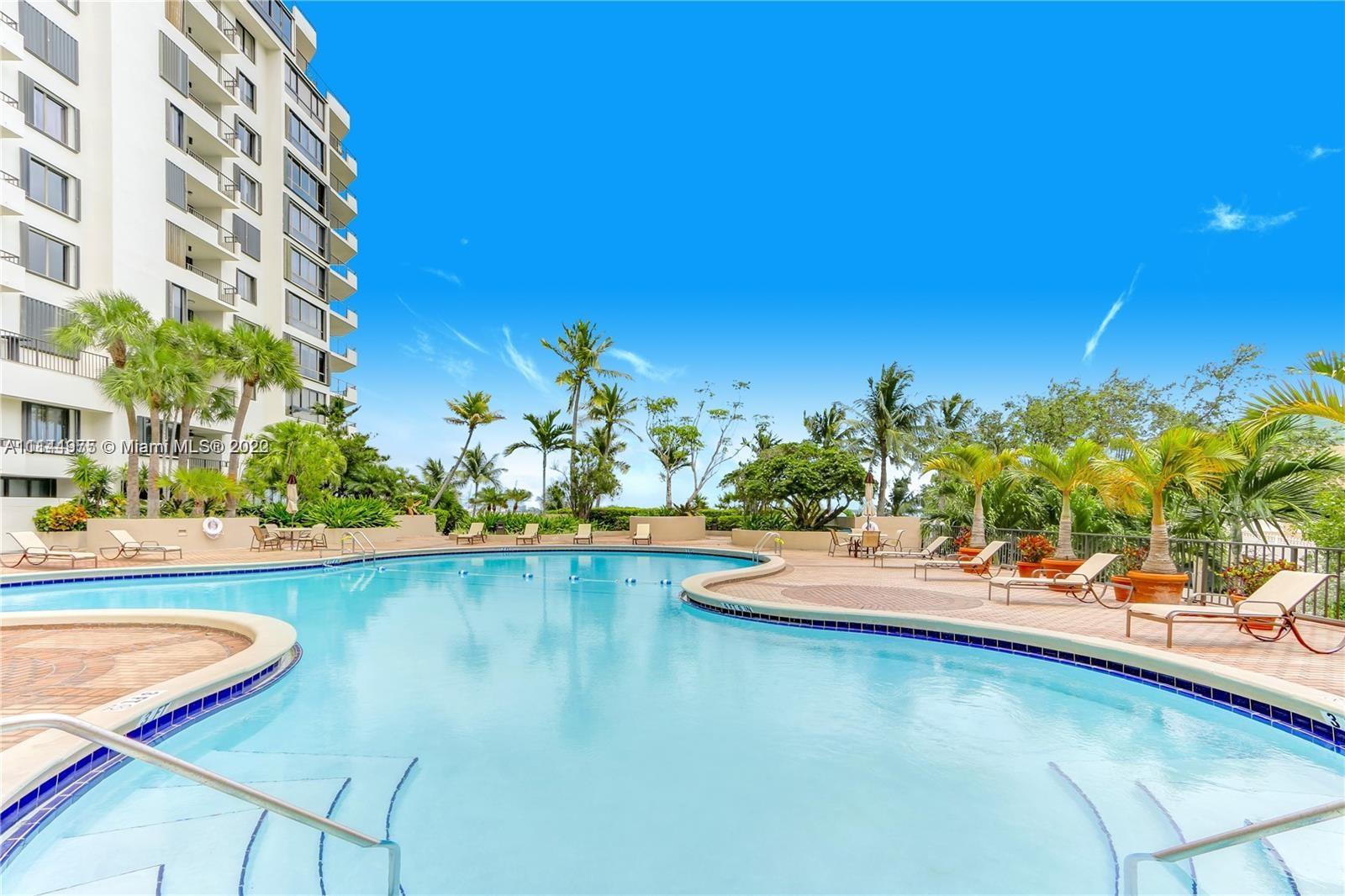 520 Brickell Key Drive, Unit A913 Miami, FL 33131 - Photo 18 of 18 a view of a swimming pool with a lounge chair