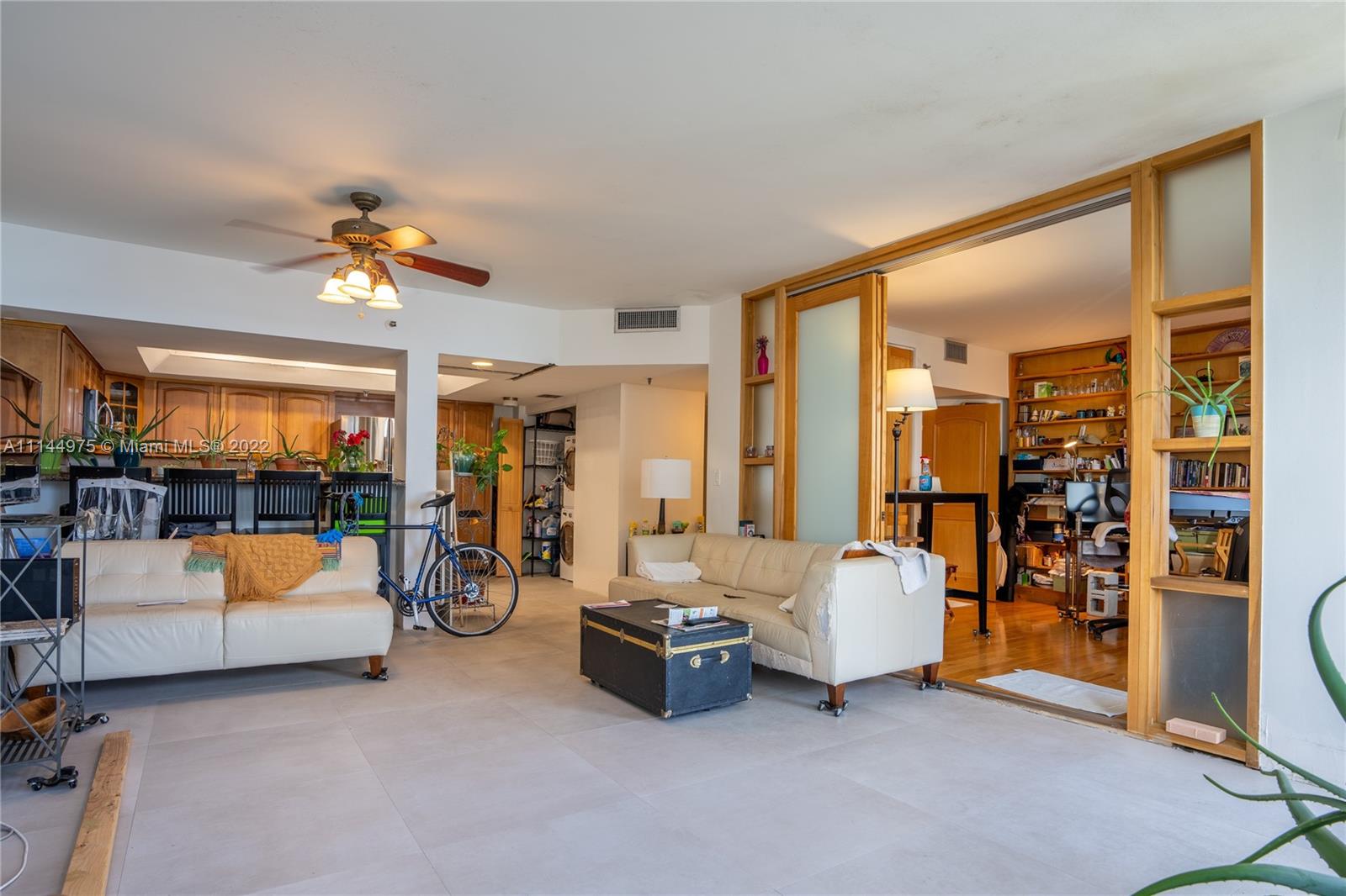 520 Brickell Key Drive, Unit A913 Miami, FL 33131 - Photo 7 of 18 a living room with furniture and white walls